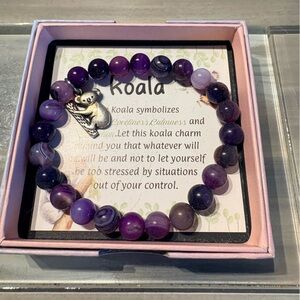 Purple beaded bracelet with Koala charm